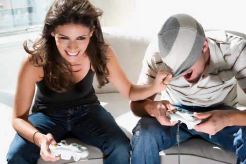 High angle view of a young couple playing video game